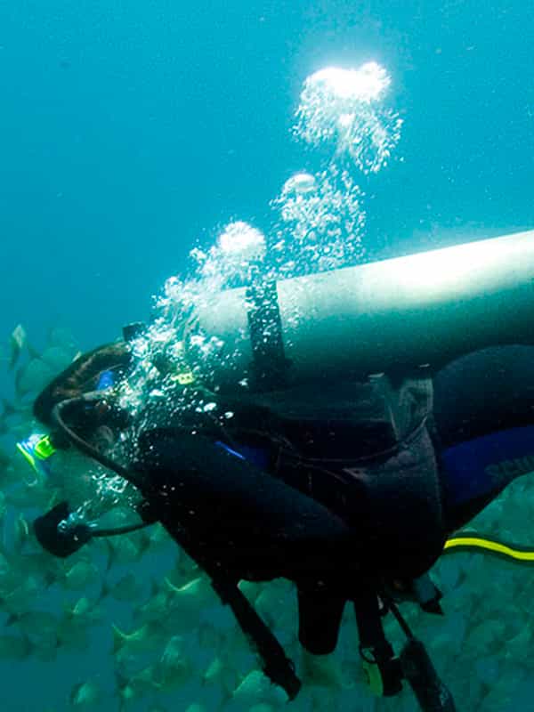 a diving man in the deeps of ocean.