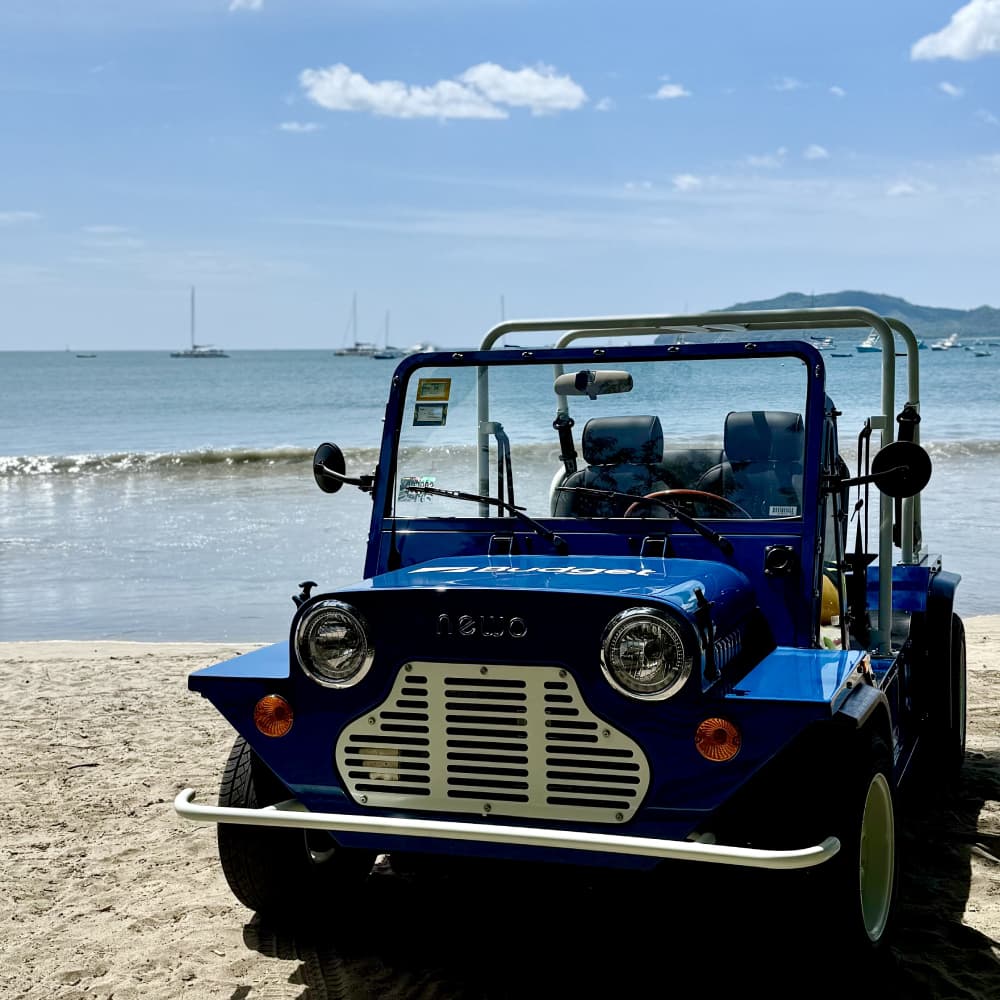 a blue vehicle on a beach