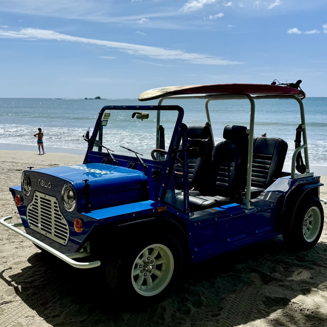 a blue vehicle on a beach