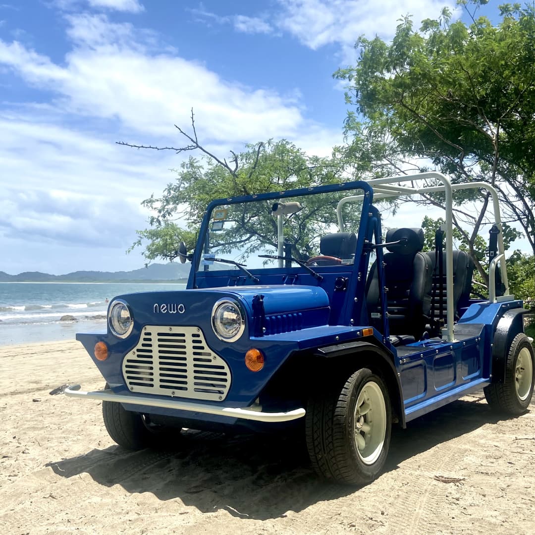 a blue vehicle on a beach