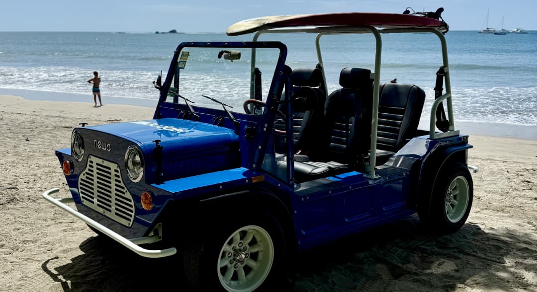 a blue vehicle on a beach